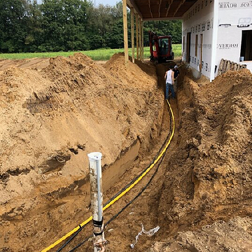 HVAC installation with underground piping at a home