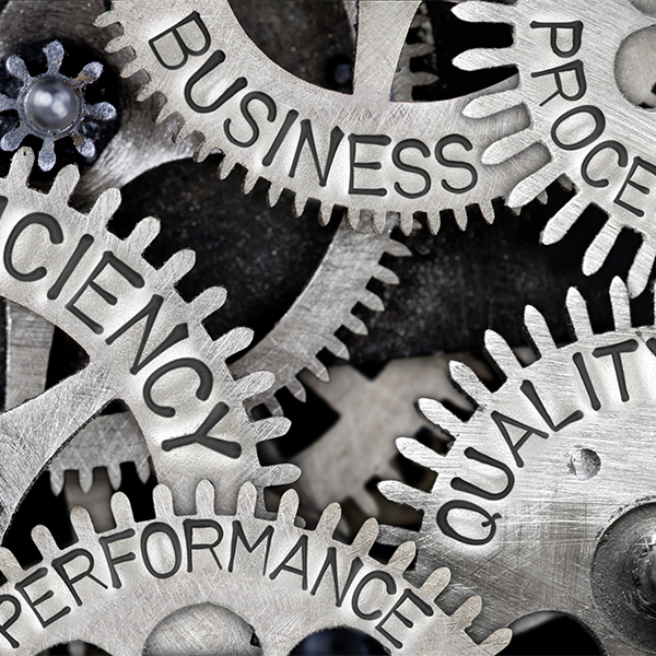 Metal gears representing business efficiency, performance, and quality
